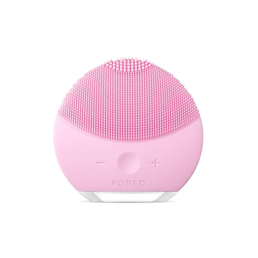 FOREO LUNA Mini 2 Pearl Pink facial cleansing brush, compact silicone device for gentle deep skin cleansing.