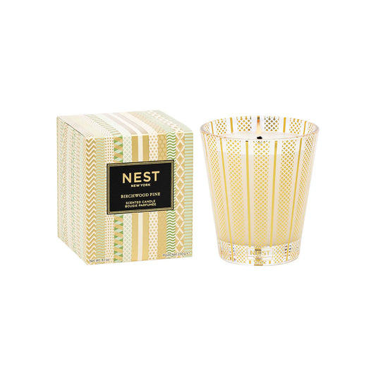 Nest New York Birchwood Pine Candle for a festive, woodsy fragrance with notes of pine, fir balsam, and birchwood