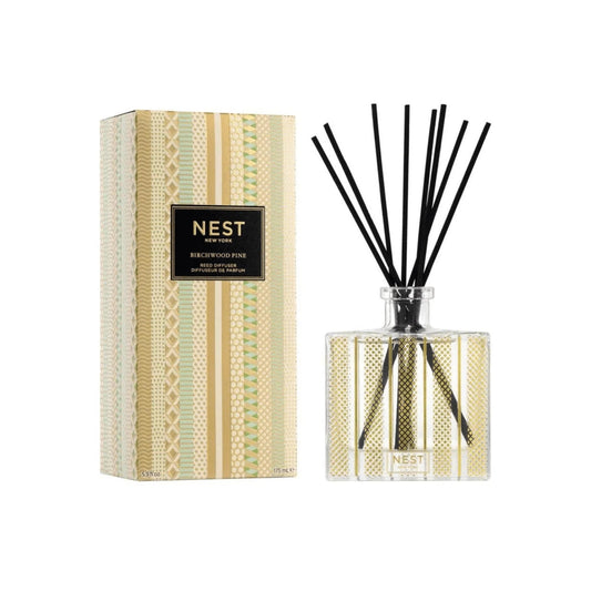 “NEST New York Birchwood Pine Reed Diffuser 175 mL with crisp, woodsy aroma for a cozy, festive home atmosphere.
