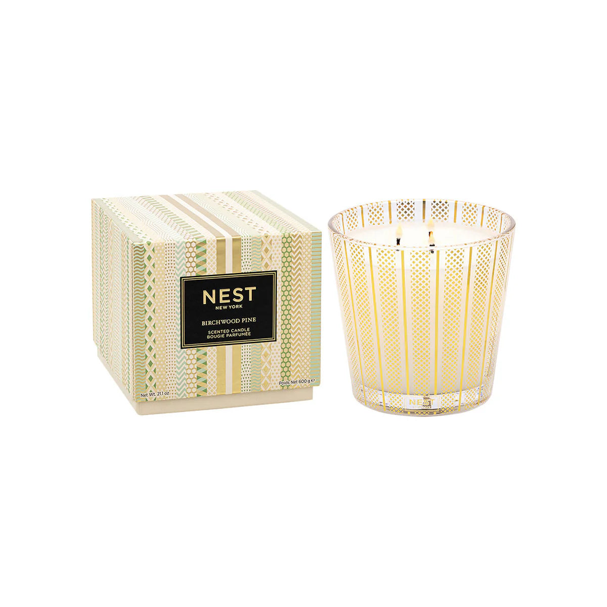 Nest New York Birchwood Pine Candle in glass jar with holiday scent