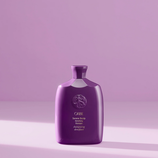 Bottle of Oribe Serene Scalp Densifying Shampoo for scalp care and hair volume.