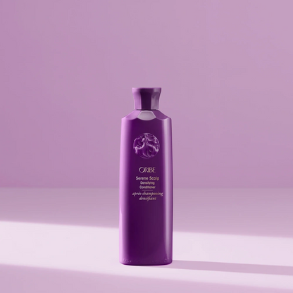 Bottle of Oribe Serene Scalp Densifying Conditioner for scalp care and hair thickening.